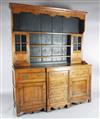 A George III oak breakfront dresser, W.5ft 8in. D.1ft 7in. H.7ft 1in.                                                                  