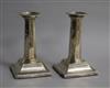 A pair of Edwardian silver candlesticks, with panelled stems, Ellis Jacob Greenberg, Birmingham, 1907, 13.2cm.                         