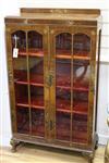 A lacquered walnut bookcase W.76cm                                                                                                     