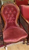 A Victorian walnut spoonback nursing chair                                                                                             