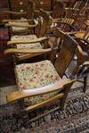 A set of four 1930's carved oak elbow chairs                                                                                           