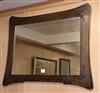 An Art Nouveau carved wood wall mirror W.99cm                                                                                          