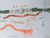 A silver plate mounted belt and minor jewellery including an agate bead necklace and a coral bead necklace.                                                                                                                 