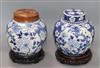 Two Chinese blue and white jars and covers and a pair of hardwood stands                                                               