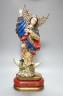 A painted South American angelic figure, standing on a dragon on a crescent moon 49cm                                                                                                                                       
