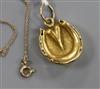 An 18ct gold "horseshoe" locket, on an 8ct gold fine link chain, locket 21mm.                                                          