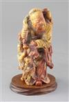 A Chinese soapstone group of an immortal and two attendants, 19th century, 17.5cm high                                                 