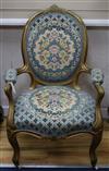 A Louis XV style giltwood fauteuil                                                                                                     