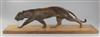 A French Art Deco bronze model of a prowling panther, width 27.5in.                                                                    