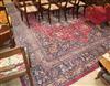 A North West Persian design crimson ground carpet 426 x 310cm                                                                          