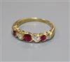 A modern 18ct gold, ruby and diamond seven stone half hoop ring, size M.                                                               