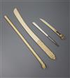 An Indian ivory backscratcher and three paperknives                                                                                    