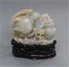 A Chinese pale celadon and russet jade 'quail' carving, wood stand 10cm high including stand                                           