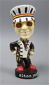 An Elton John bobble head                                                                                                              