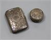 A silver cigarette case and a silver pill box.                                                                                         