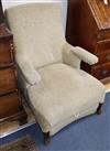 A 19th century French metamorphic armchair, with folding armrest                                                                       