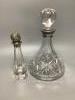 A silver collared cut glass decanter and a glass scent bottle with 800 standard silver stopper, tallest 27cm and a set of 5 etched wine glasses.                                                                            