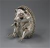 A 1990's novelty silver "seated hedgehog" money box by Asprey & Co Ltd, London, 1994, 12 oz.                                           