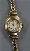 A lady's 9ct gold Bentimo manual wind wrist watch on a 9ct gold bracelet.                                                              