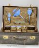 An early 20th century leather vanity case, with enclosed accessories and five further silver mounted vanity bottles                                                                                                         