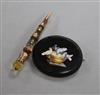 A micromosaic oval "Pliny Doves" brooch and a yellow metal and Scottish hardstone dirk brooch.                                         