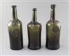 Three black glass mallet shaped wine bottles, height 26cm (3)                                                                          
