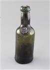 A rare Bristol black glass half wine bottle, height 18.5cm                                                                             