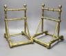 A pair of 19th century Dresser or Godwin style brass fire dogs                                                                                                                                                              