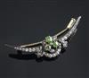 A late Victorian, gold and silver, diamond and demantoid garnet set shaped crescent brooch, 49mm.                                      