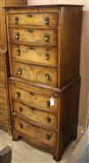 A Georgian style walnut chest on chest of serpentine form W.63cm                                                                       