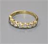 A modern 18ct gold and seven stone diamond half hoop ring, size O.                                                                     