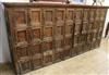 A large 19th century Continental pitch pine forty door locker cabinet W.299cm                                                          