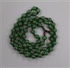 A Chinese green hardstone bead necklace                                                                                                