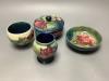 Four pieces of Moorcroft including a covered powder box                                                                                                                                                                     