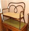 A late Victorian child's bentwood caned seated settee W.85cm                                                                           