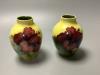 A pair of Moorcroft yelow ground Hibiscus vases, height 9cm                                                                                                                                                                 