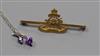 A 9ct gold Royal Artillery bar brooch and a silver and gem set necklace.                                                               