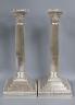 A pair of Edwardian silver Corinthian column candlesticks, Goldsmiths & Silversmiths Co Ltd, London, 1903, 27.4cm, weighted.                                                                                                