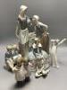 Four Nao figures and a Lladro group                                                                                                                                                                                         