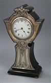 A George V Art Nouveau silver mounted ebonised mantle timepiece, G.E Walton & Co Ltd, Birmingham, 1910, 32cm.                          