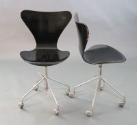 A pair of Arne Jacobsen-style Fritz Hansen 3177 ebonised bentwood revolving desk chairs, W.1ft 7in. D.1ft 7in. H.2ft 10in.             