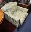 A George II design armchair upholstered in patterned green fabric                                                                      