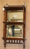 A late Victorian mahogany mirrored back three shelf wall bracket W.129cm                                                               