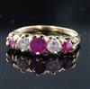 A gold, three stone ruby and two stone diamond set half hoop ring, size M                                                              