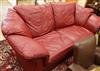 A red leather settee W.220cm                                                                                                           