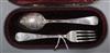 A cased late Victorian silver christening fork and spoon, Josiah Williams & Co, London, 1889.                                          