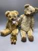 A vintage large plush jointed teddy bear with glass eyes and long muzzle, a later smaller jointed bear and a similar miniature bear, length 58cm                                                                            