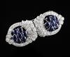 A 1960's? white gold, sapphire and diamond double clip brooch, 50mm.                                                                   