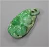 A jade pendant carved with fruit, 36mm.                                                                                                