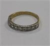 An early 1970's 18ct gold and ten stone diamond half eternity ring, size Q.                                                            